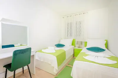 Krevet ili kreveti u jedinici u objektu Apartman Oliva and Studio Delux for a family with swiming pool, free parking, terace with view at the sea