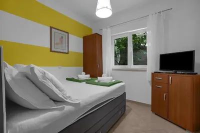 TV i/ili zabavni centar u objektu Apartments Harmony of Five