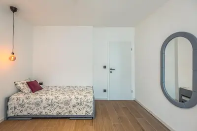 Krevet ili kreveti u jedinici u objektu Vogue Apartments