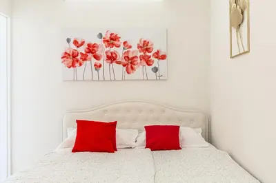Krevet ili kreveti u jedinici u objektu Three Rocks Beach Suite