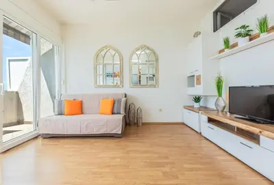 TV i/ili zabavni centar u objektu Three Rocks Beach Suite