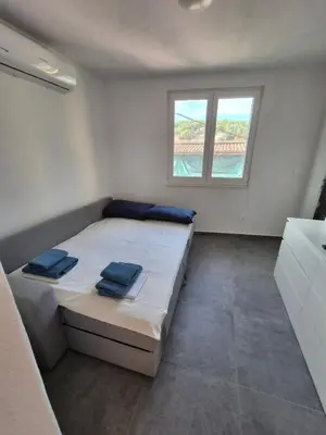 Krevet ili kreveti u jedinici u objektu Apartman Pia, JELSA