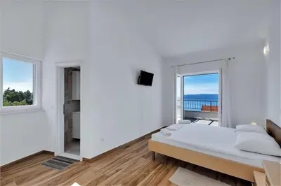 Krevet ili kreveti u jedinici u objektu Villa Magico with pool and fantastic seaview