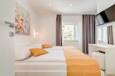 Krevet ili kreveti u jedinici u objektu Apartments Villa Tudor 1