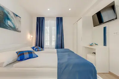 Krevet ili kreveti u jedinici u objektu Apartments Villa Tudor 2