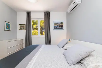Krevet ili kreveti u jedinici u objektu APARTMANI MARIS