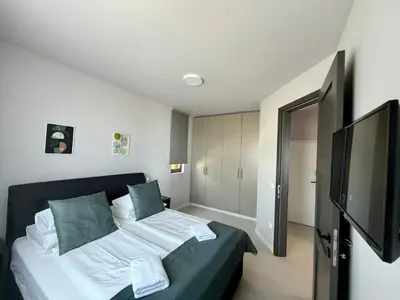 Krevet ili kreveti u jedinici u objektu DINORA Exclusive Apartments