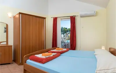 Krevet ili kreveti u jedinici u objektu Beach Front Apartment In Baska Voda