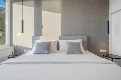 Krevet ili kreveti u jedinici u objektu Villa Grey with 4 bedrooms, Heated pool, Sauna, Media room, Sea Views