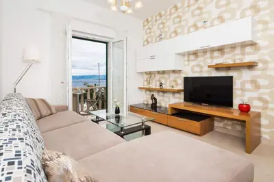 TV i/ili zabavni centar u objektu Apartment Riva Mare with Sea View in the center