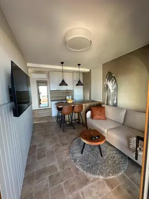 TV i/ili zabavni centar u objektu New Luxury Apartments at Villa A'more - by the Sea