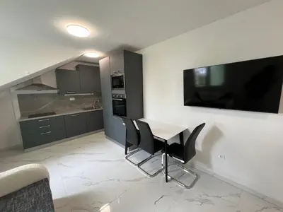 TV i/ili zabavni centar u objektu New Comfort Studio Apartment