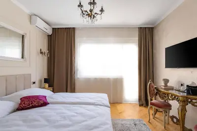 Krevet ili kreveti u jedinici u objektu Storge Boutique Bed & Breakfast