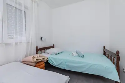 Krevet ili kreveti u jedinici u objektu Family-friendly apartments with swimming pool Brela, Makarska - 22910