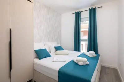Krevet ili kreveti u jedinici u objektu TT Apartment with sea view and private parking