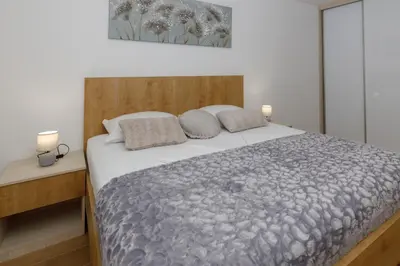 Krevet ili kreveti u jedinici u objektu Apartman s pogledom na more 
