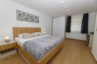Krevet ili kreveti u jedinici u objektu Apartman s pogledom na more 