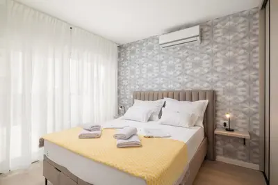 Krevet ili kreveti u jedinici u objektu TT - Apartments with private parking