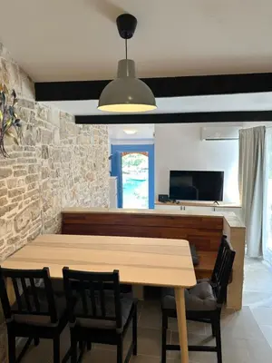 TV i/ili zabavni centar u objektu Apartment By the Sea