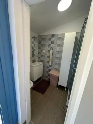 Kupaonica u objektu Apartment By the Sea