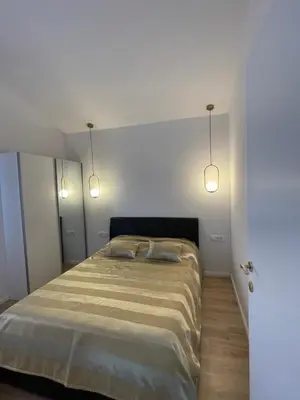 Krevet ili kreveti u jedinici u objektu Apartman V