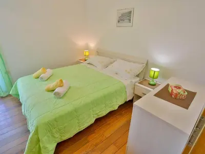 Krevet ili kreveti u jedinici u objektu Apartments Lenka - Two Bedroom Apartment with Garden Terrace A4