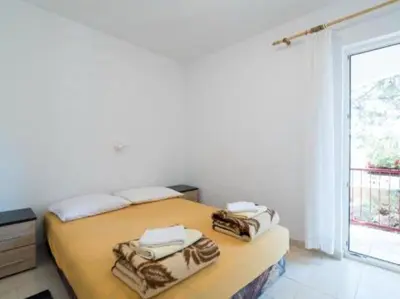 Krevet ili kreveti u jedinici u objektu Apartments Boguvila - Two-Bedroom Standard Apartment with Terrace A6 - ST