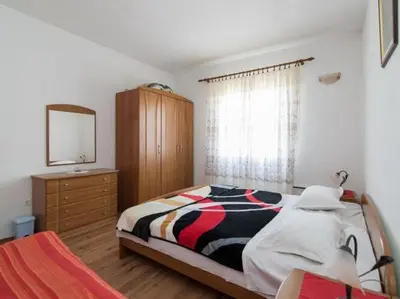 Krevet ili kreveti u jedinici u objektu Apartment Alana - Two Bedroom Apartment with Terrace and Sea View - ST