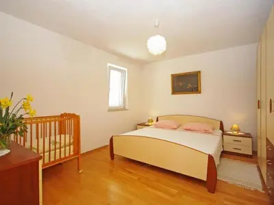 Krevet ili kreveti u jedinici u objektu Apartments Villa Rose - Two-Bedroom Apartment with Sea View Terrace