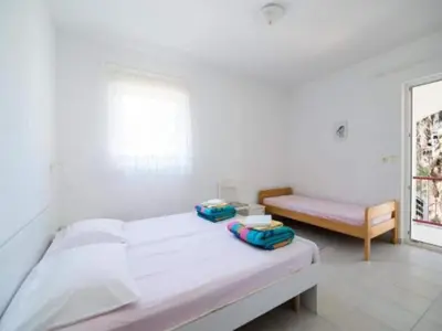 Krevet ili kreveti u jedinici u objektu Apartments Boguvila - Two-Bedroom Family Apartment with Terrace A2 - ST
