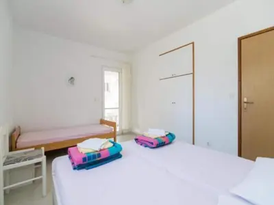 Krevet ili kreveti u jedinici u objektu Apartments Boguvila - Two-Bedroom Family Apartment with Terrace A2 - ST