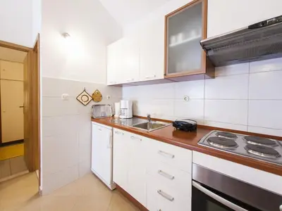 Kuhinja ili čajna kuhinja u objektu Apartments Magdalena - Bungalow with terrace A1