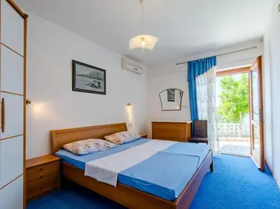 Krevet ili kreveti u jedinici u objektu Villa Kosa - Two Bedroom Apartment with Terrace and Sea View A1 Prizemlje