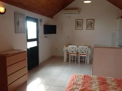 TV i/ili zabavni centar u objektu Holiday Home Oliva - Holiday House with Terrace and Sea View
