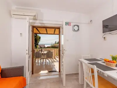TV i/ili zabavni centar u objektu Apartments Magdalena - Apartment with Sea View and Terrace A3
