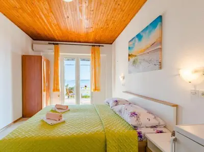 Krevet ili kreveti u jedinici u objektu Rooms Sani - Double Room with Terrace and Sea View S3