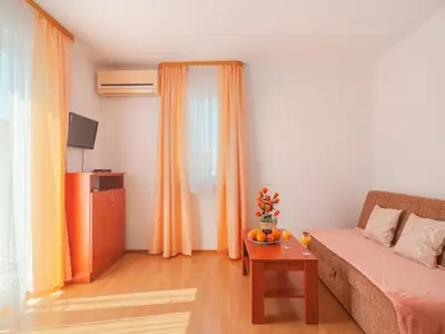 TV i/ili zabavni centar u objektu Apartments Island Beat - Two Bedroom Apartment with Balcony A3 ST