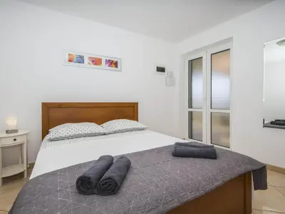 Krevet ili kreveti u jedinici u objektu Villa Dvori Vi kovi-Seven Bedroom Villa with Swimming Pool