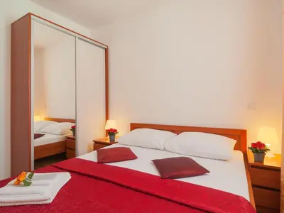 Krevet ili kreveti u jedinici u objektu Apartments Island Beat - Two Bedroom Apartment with Balcony and Sea View A2 ST