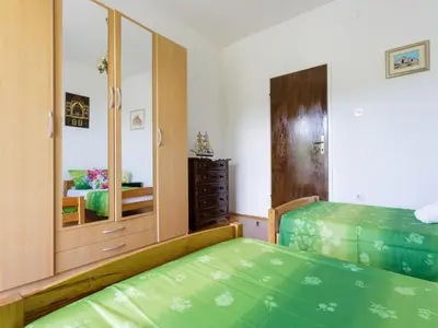 Krevet ili kreveti u jedinici u objektu Apartments Sunrise Duilovo -Three Bedroom Apartment with Sea View Terrace