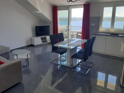 TV i/ili zabavni centar u objektu Apartments Dobrila - One Bedroom Apartment with Terrace and sea view - B1