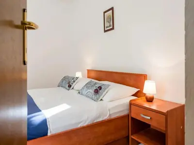 Krevet ili kreveti u jedinici u objektu Apartments Villa Pelegrin - Two Bedroom Apartment with Garden View