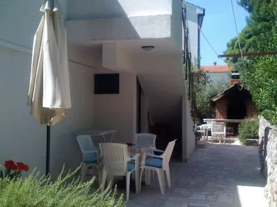 TV i/ili zabavni centar u objektu Apartments Villa Pelegrin - Studio Apartment with Sea View Apartment