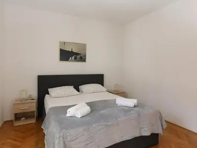 Krevet ili kreveti u jedinici u objektu Apartment Perina - Comfort Two Bedroom Apartment with Terrace and Sea View