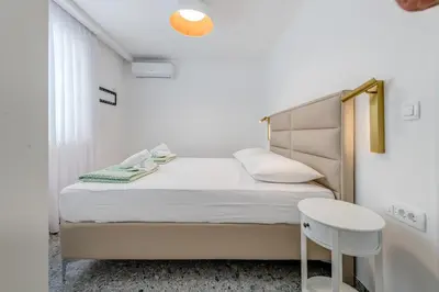 Krevet ili kreveti u jedinici u objektu DeLuxe Seaview Apartment KENNEDY I