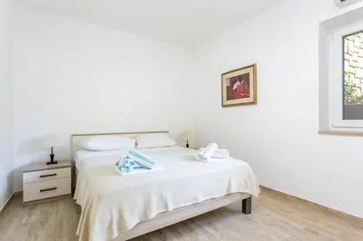 Krevet ili kreveti u jedinici u objektu Apartments by the sea Brela, Makarska - 21803