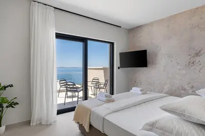 Krevet ili kreveti u jedinici u objektu Seaview Villa Libero with spa zone, pool, billiard
