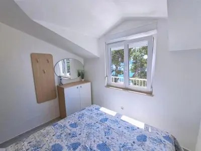 Krevet ili kreveti u jedinici u objektu Apartments by the sea Medici, Omis - 23741