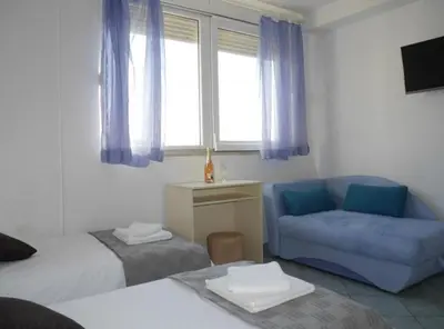 Krevet ili kreveti u jedinici u objektu Dugi Rat Seaside Apartments