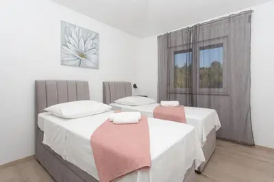 Krevet ili kreveti u jedinici u objektu Family friendly house with a swimming pool Srinjine, Split - 23770
